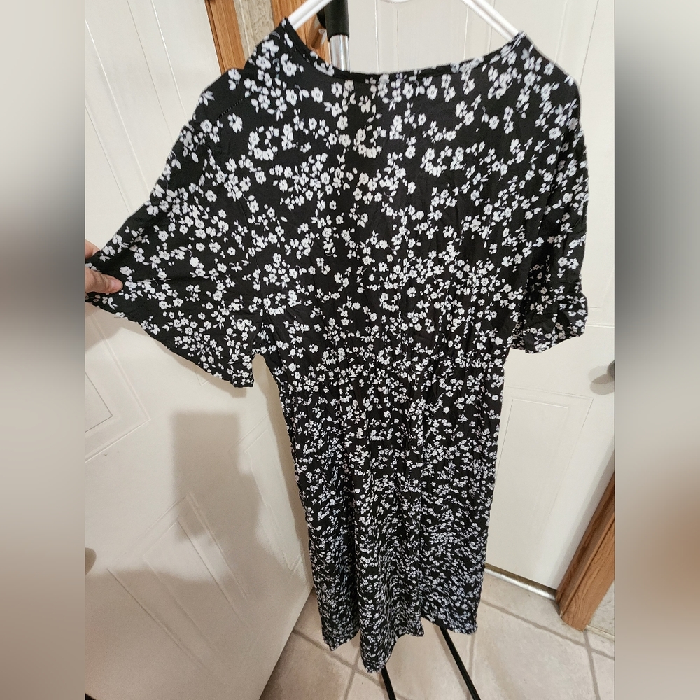 Plus size black dress with white flowers